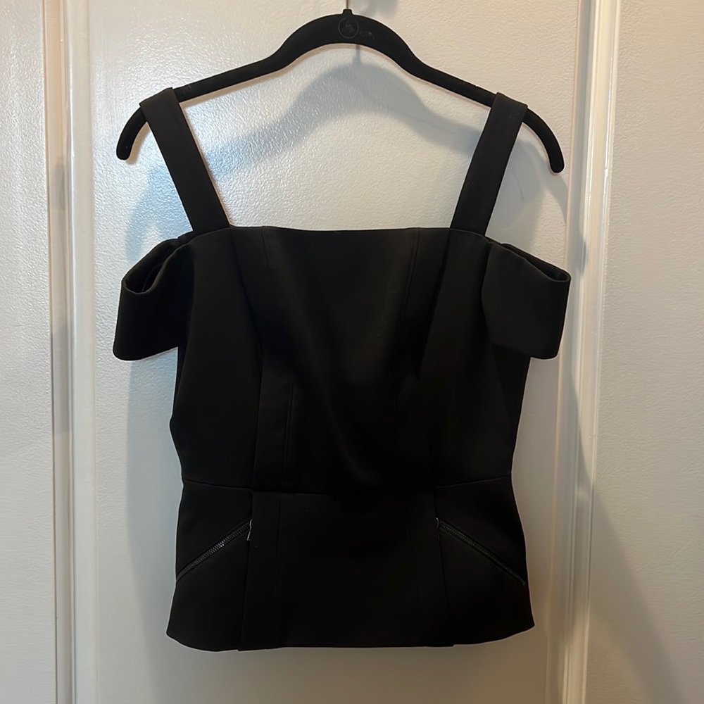 BCBG MAXAZRIA peplum cold shoulder top in black NWT
